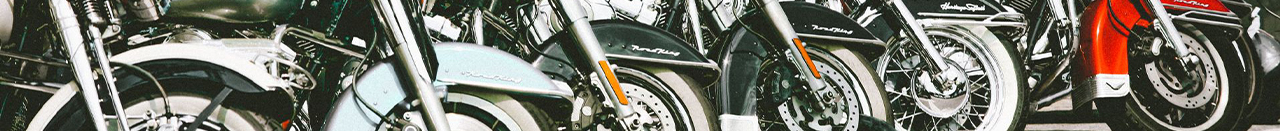GM Insurance Services motorcycle insurance header image showing a motorcyclist riding on open road representing bike coverage protection.